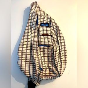 Kavu sling bag. Cream color with brown design.